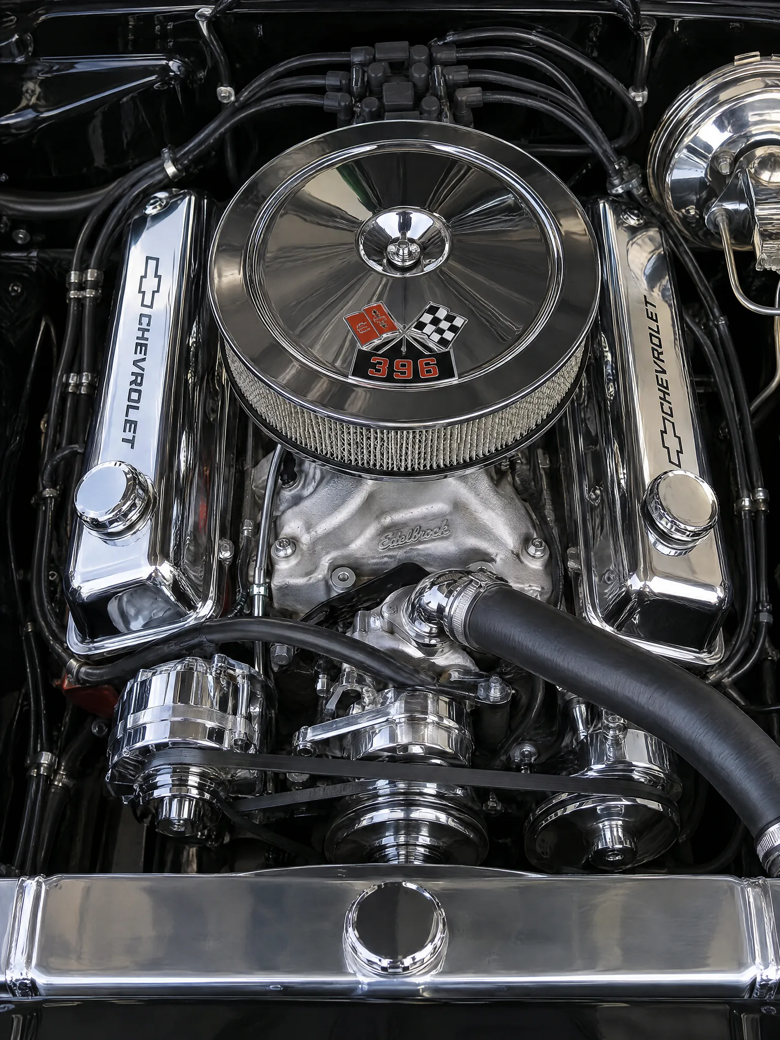 An immersive view into a classic muscle car’s chrome and steel engine